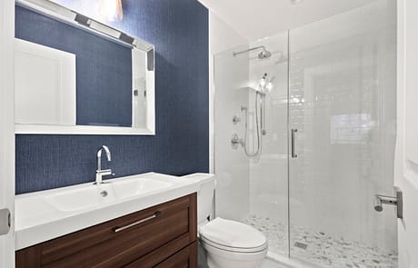 Remodeled Bathroom with Subway tiles and Custom Flooring